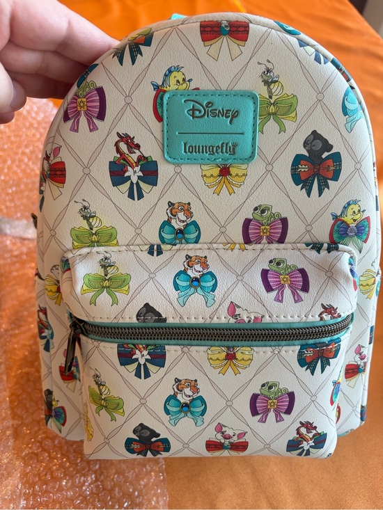 Loungefly Handbags - Loungefly Cream Mini Backpack with Multicolor Sidekick Bows